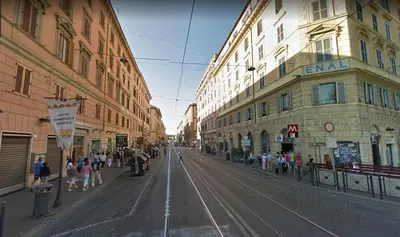 a city street with buildings and people walking on the street at Spartacus Inn Apartment in Rome