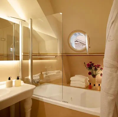a bathroom with a tub and a sink at Elizabeth Unique Hotel | a Member of Design Hotels™ in Rome