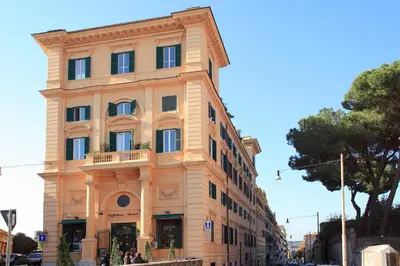 a tall building in the middle of a street at Appartamento d'epoca Colosseo Art Gallery in Rome
