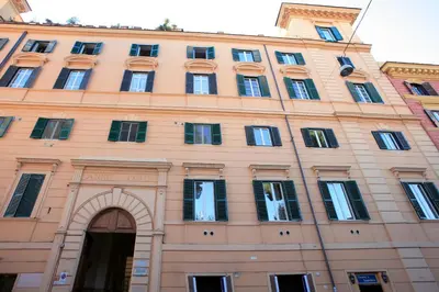 a large building with an arch in front of it at Appartamento d'epoca Colosseo Art Gallery in Rome