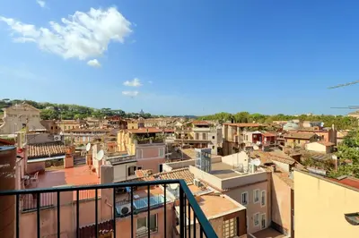 a view of a city from a balcony at Vicolo del Cinque Penthouse | Romeloft in Rome