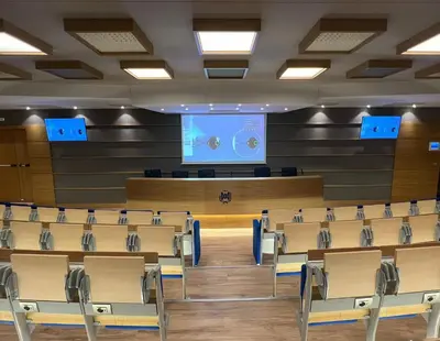 a lecture hall with chairs and a projection screen at Villa Angelina in Rome