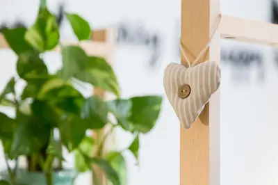 a wooden heart on a door with a plant at Vatican 96 Degli Ubaldi Studio steps from metro and St Peter's in Rome