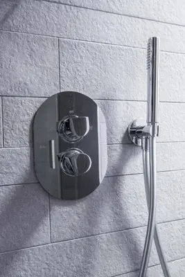 a mirror on the wall of a shower at Charming Roma in Rome
