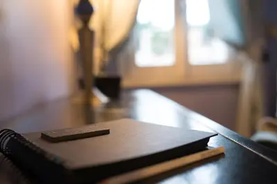 a book sitting on top of a wooden table at Hotel Villa Linneo in Rome
