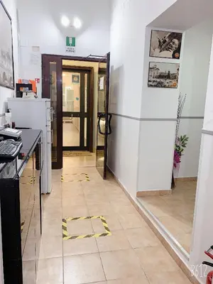 a room with a glass wall and a kitchen with a floor at Golden Ratio in Rome