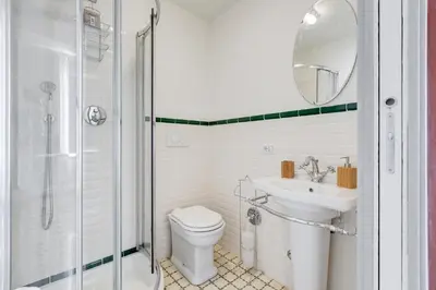 a bathroom with a toilet and a sink and a shower at Monti Colosseum apartment in Rome