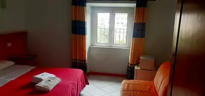a bedroom with a bed and a window at Fanti Rooms in Rome