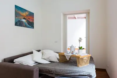 a living room with a couch and a table at The Royal Story in Rome