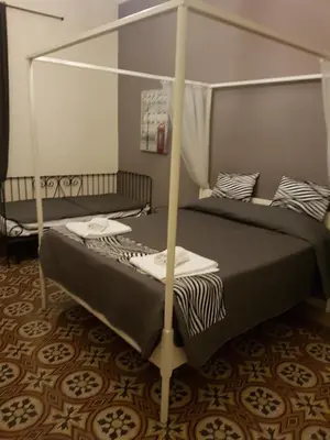 a bedroom with two bunk beds in a room at Happy Stay Guesthouse in Rome