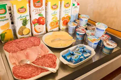 a counter with some food and drinks on it at Affreschi Su Roma Luxury B&B in Rome