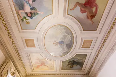 a ceiling with paintings on it in a building at Affreschi Su Roma Luxury B&B in Rome
