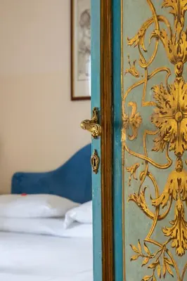 a door with a gold and blue paint on it at Martina House in Rome