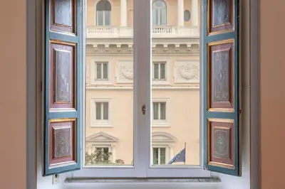 an open window with a view of a building at Martina House in Rome