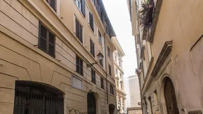 an alley between two buildings in a city at Leutari Suite in Rome