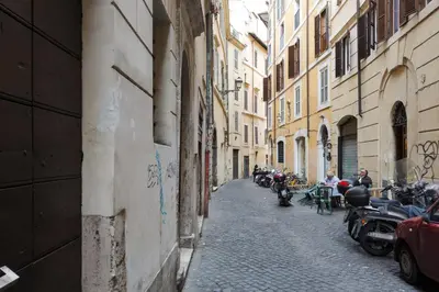 an alley with motorcycles parked on the side of a building at Leutari Suite in Rome
