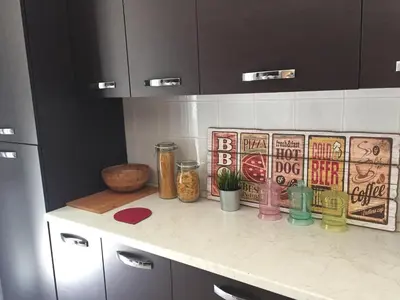 a kitchen counter with jars and plants on it at BenS'Houses - Villa Pamphili apartment in Rome
