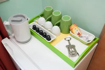 a toy kitchen with a table with eggs and a magnifier at World Wide Bed - Prenestino in Rome