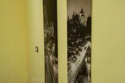a black and white picture of a city on a wall at World Wide Bed - Prenestino in Rome