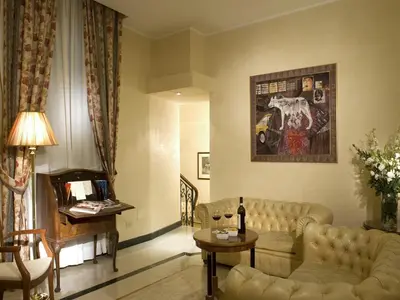 a living room with a couch and a table at Hotel Aberdeen in Rome