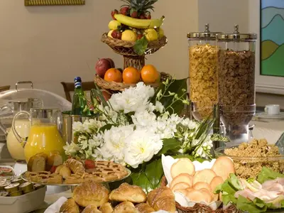 a table topped with lots of different types of food at Hotel Aberdeen in Rome