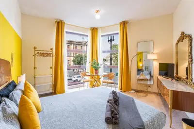 a bedroom with a bed and a mirror at BigFamilyRome - Vatican & Navona in Rome