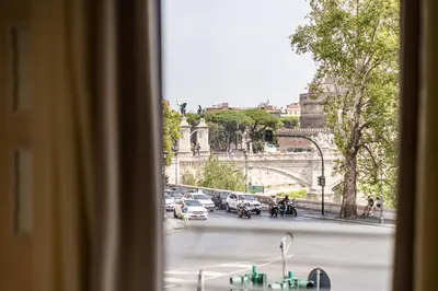 a view from a window of a street with cars at BigFamilyRome - Vatican & Navona in Rome