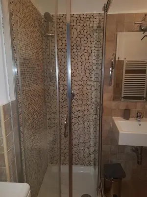 a bathroom with a shower and a sink at barberini holiday house in Rome