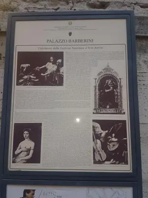 a framed picture of a picture of a man and a woman at barberini holiday house in Rome
