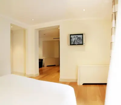 a bedroom with a bed and a painting on the wall at Hotel Albergo Santa Chiara in Rome