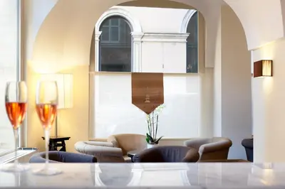 a living room with couches and a large window at Hotel Albergo Santa Chiara in Rome
