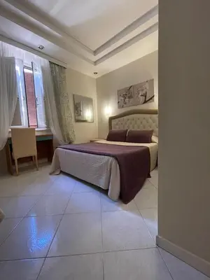 a bathroom with two beds and a sink and a mirror at B&B Andy&LU in Rome