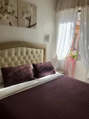 a living room with a couch and a table at B&B Andy&LU in Rome