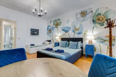 a living room with a bed and a table at BigFamilyRome - Spanish Steps in Rome