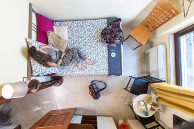 an overhead view of a room with a bed with pillows at BigFamilyRome - Sistine Chapel in Rome