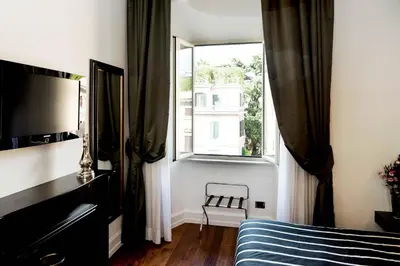 a bedroom with a bed and a window at Le Stanze Di Federica in Rome