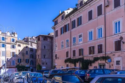 a group of cars parked in front of buildings at GuestHost - Palazzo Farnese Historical Home in Rome