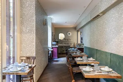 a dining room with wooden tables and chairs at Glance in Rome in Rome