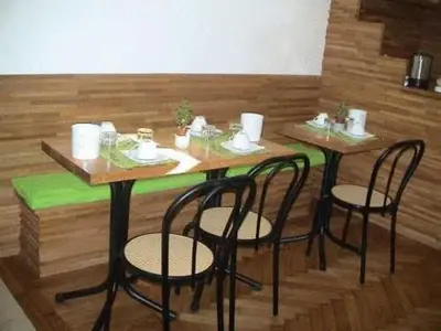 a table with four chairs in a room at B&B La Casa Di Rosy in Rome