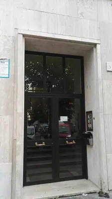a window of a building with a black door at Sweet home Appio Latino in Rome