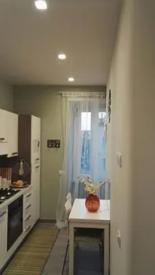 a kitchen with a table with a pumpkin on it at Sweet home Appio Latino in Rome