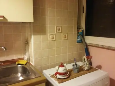 a small kitchen with a sink and a counter top at Monolocale Monteverde in Rome
