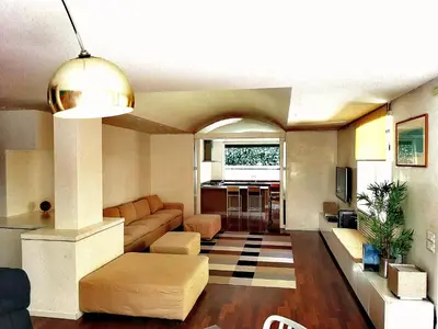 a living room with a couch and a table at Cadlolo Luxury Retreat - Rome Cavalieri and Villa Miani in Rome