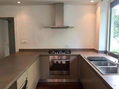 a kitchen with a stove top oven next to a sink at Cadlolo Luxury Retreat - Rome Cavalieri and Villa Miani in Rome