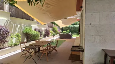an outdoor patio with a table and chairs at Cadlolo Luxury Retreat - Rome Cavalieri and Villa Miani in Rome