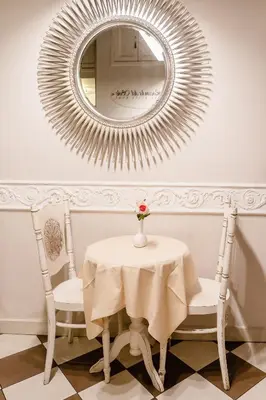 a table and two chairs and a mirror at Locanda Del Sole-Roma Piazza Di Spagna Ripetta in Rome