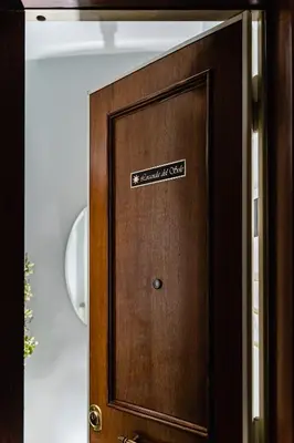 a wooden door with a sign on it at Locanda Del Sole-Roma Piazza Di Spagna Ripetta in Rome