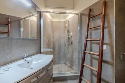 a bathroom with a sink and a shower at Appartamento Trevi Vicolo Scanderbeg in Rome