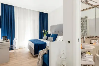 a hotel room with a bed and a bathroom at Residenza Zanardelli in Rome