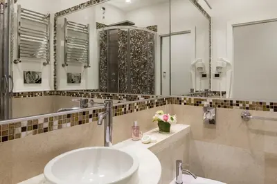 a bathroom with a sink and a mirror at Residenza Zanardelli in Rome